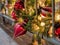 Pine cones, snowflakes, peppermints, and other ornaments decorating a Christmas tree for the holiday