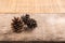 Pine cones on wooden background