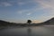 Pine forest island and shrubs refection on the lake at dawn with magic of the sky and clouds part 3