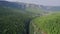 Pine forest and steep cliffs. Mountain landscape in Turkey canyon Tazy. Amazing aerial view  video