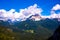 Pine forests and pink dolomites among white clouds