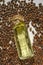 Pine oil.shelled pine nuts and a bottle of cedar oil.glass bottle with oil lies in pine nuts on a white background