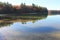 Pine reflections and filtered sunlight in November at Walden Pond. 2015