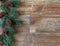 Pine swag with pine cones  on rustic wood backgroun