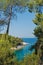 Pine tree on a rock over crystal clear turquoise water, Cape Amarandos at Skopelos island