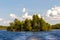 Pine trees on the small island in the middle of the lake. Karelia, Russia