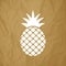 Pineapple Ananas icon white on a crumpled paper brown background.