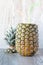 Pineapple close-up on wood on marble  background