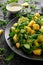 Pineapple Cucumber salad with wild green rocket, lime and olive oil. Healthy juicy food