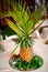 Pineapple decoration with palm leaves