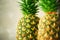 Pineapple fruit background. Close up of tropical pineapples texture. Summer, holiday concept. Raw, vegan, vegetarian
