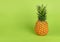 Pineapple on green background