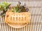 Pineapple pie and lettuce in wooden plate on wooden table