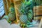 Pineapple, that are placed in wooden crates, fresh taste sweet.