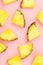 Pineapple slices on pink background. Tropical juicy exotic healthy fruit texture. Top view, flat lay, minimal.