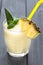 Pineapple Smoothie with Mint and a Piece of Pineapple, Dark Background, Vertical