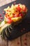 Pineapple stuffed with fresh exotic fruits close-up. Vertical