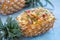 Pineapple stuffed with fried rice, chicken and vegetables