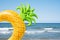 Pineapple swim ring on the beach