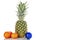 Pineapple, tangerines, Christmas toy on a white background