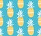 Pineapple texture with hand drawn yellow fruits at blue background. Seamless vector pattern.