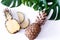 Pineapple with tropical leaves on white background