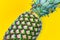 Pineapple on yellow background. Summer concept. Flat lay, top view. Digital signal glitch effect rgb shift, slices. Screen error