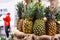 Pineapples on the counter in the store. Retail trade in exotic fruits. Close-up