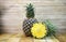 Pineapples fruit on wooden table background