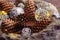 Pinecones, christmas ornaments and garland in fur hat