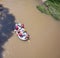 Pineios River rafting, Vale of Tempi, Thessaly, Greece. Tourist on a raft, brown water, above view