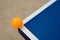 Pingpong ball hits the corner of a pingpong table