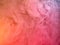 Pink acrylic paint cloud, close up view. Blurred background. Ink dropped into water, abstract background. Acrylic smoke