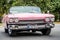 Pink american classic cabriolet car on the street in Santa Clara Cuba