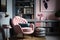 pink armchair surrounded by collection of art books, adding a touch of sophistication