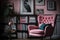 pink armchair surrounded by collection of art books, adding a touch of sophistication