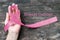 Pink awareness ribbon symbolic bow color raising support campaign on people living life with tumor Breast cancer