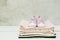 Pink baby girl shoes and newborn clothes. Motherhood, education or pregnancy concept with copy space. Greeting card