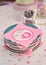 Pink baby shower napkins on plates