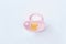 Pink baby silicone pacifier.
