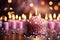 Pink backdrop hosts festive birthday candles, illuminating the celebrations joyful atmosphere