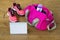 Pink bag for sports and and things for fitness on a wooden background