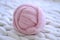 Pink ball of merino wool