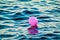 Pink Balloon Drifting At Sea