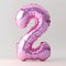 A pink balloon shaped like the number 2