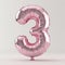 A pink balloon shaped like the number three