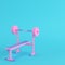 Pink barbell with bench on bright blue background in pastel colors. Minimalism concept