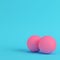 Pink basketball balls on bright blue background in pastel colors. Minimalism concept