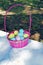 Pink baskets filled with Easter eggs