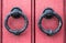 Pink behind doorknockers